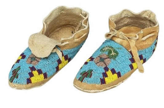 a pair of beaded moccasin