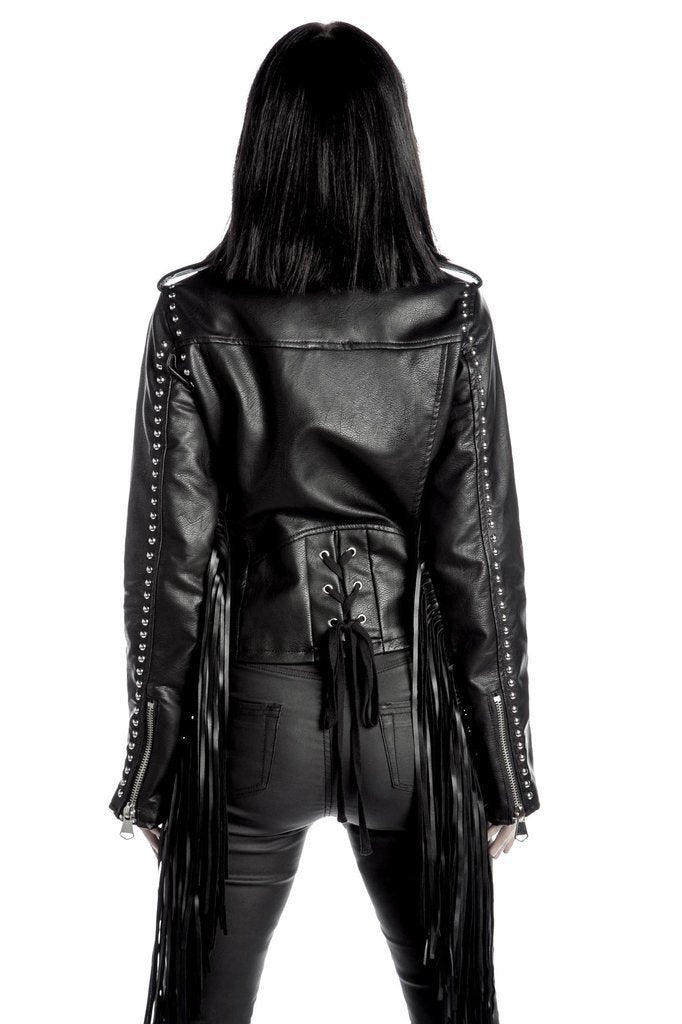 Women's black fringe moto jacket with long tassel sleeves, silver stud details, fitted biker silhouette, and Western-inspired fashion styling.