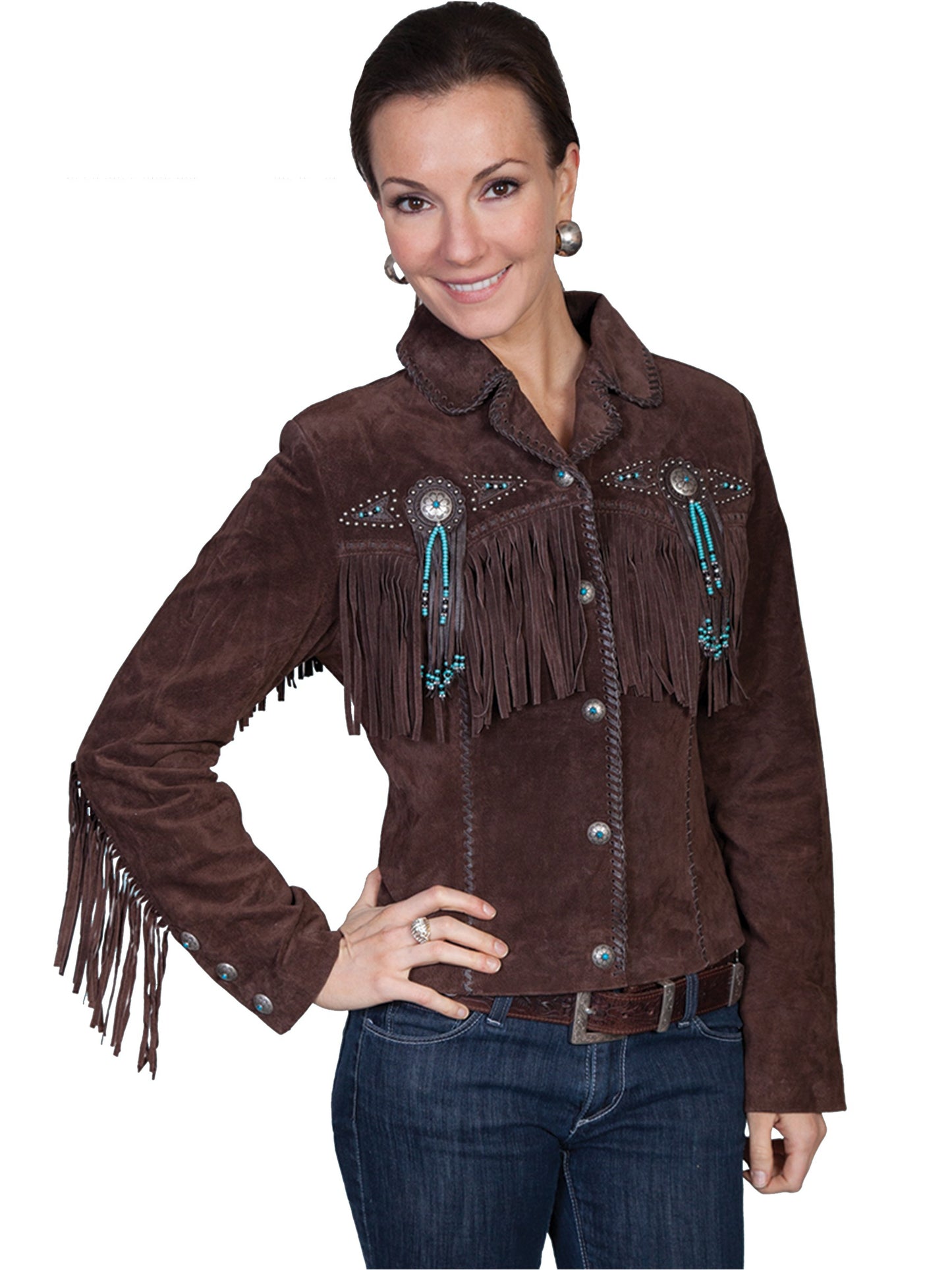 Woman wearing a brown suede jacket with fringes and embellishments on a white background