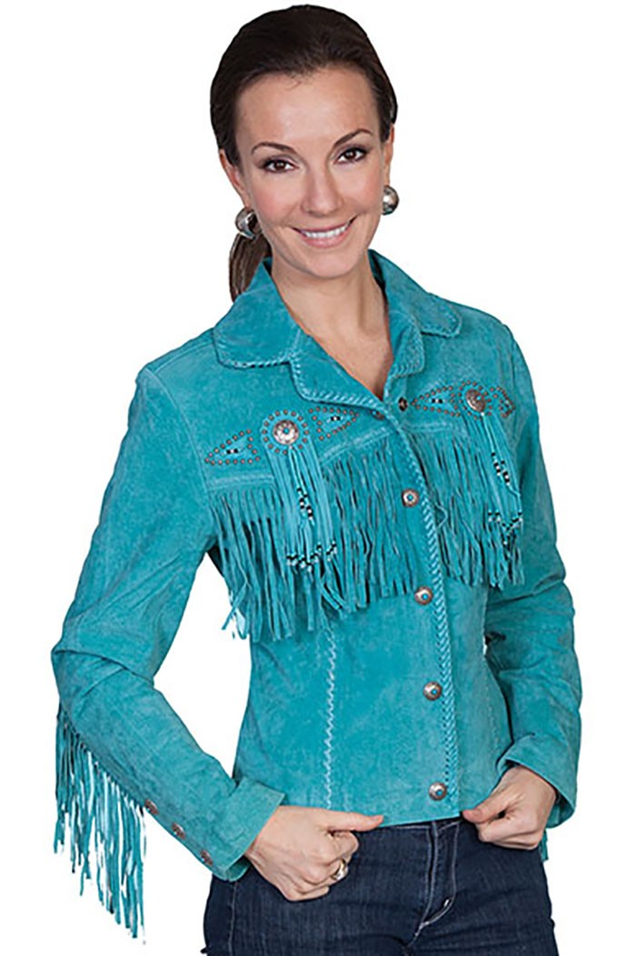Woman wearing a turquoise denim jacket with fringes on a white background
